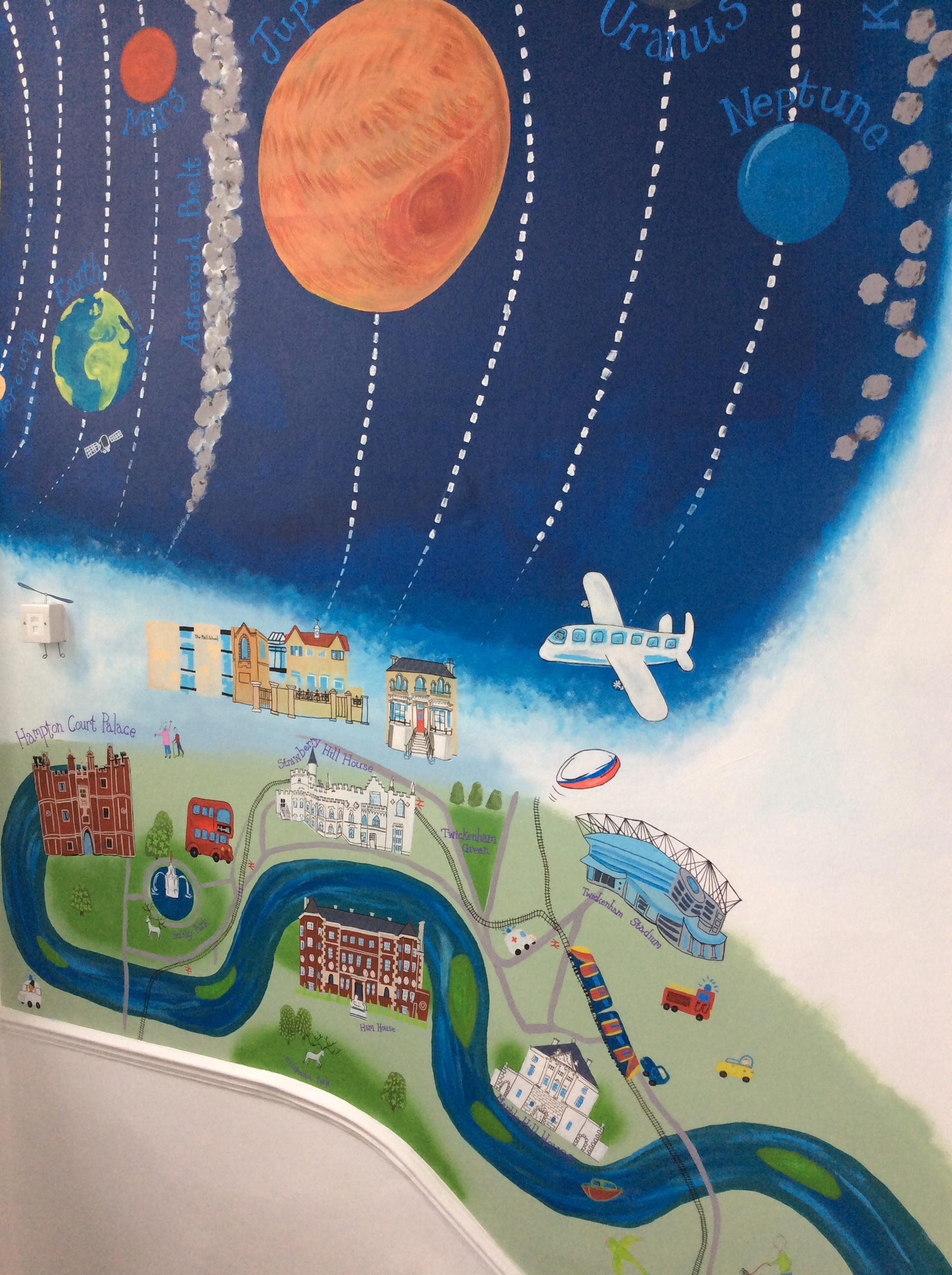 Section of a hand-painted mural at The Mall School